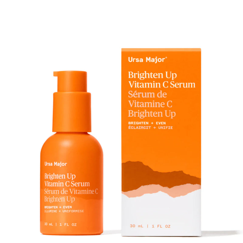 Orange serum bottle and packaging of Ursa Major Brighten Up Vitamin C Serum on a white background